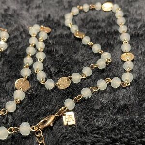 BANANA REPUBLIC Necklace. 
Gold plated coin & Fancy Cut Beads (milky green).